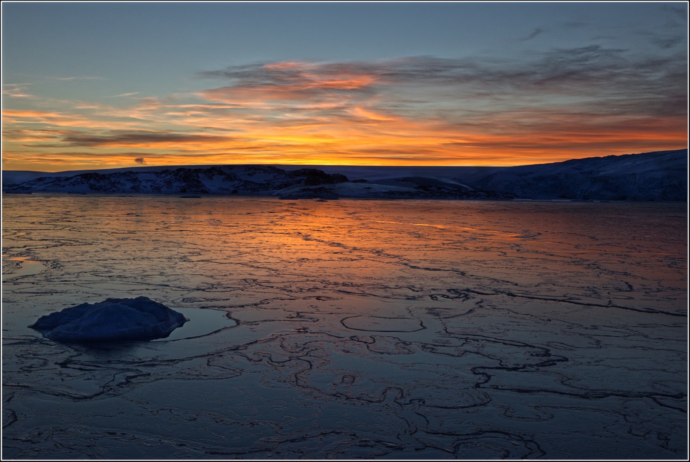 Sunset over a frozen bay