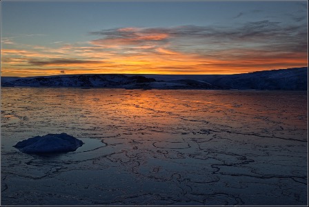 Sunset over a frozen bay