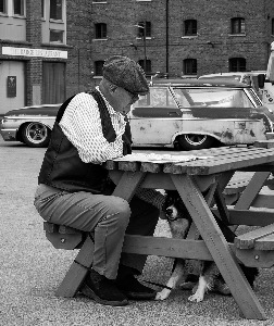 man, dog & newspaper