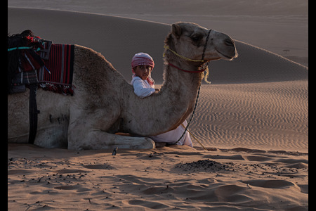 Boy With His Camel