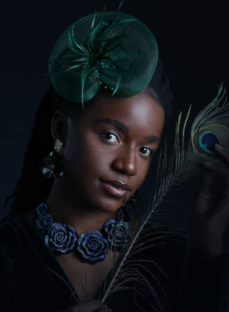The Girl Holding Peacock Feathers