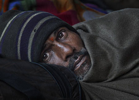 Leaning Against His Suitcase