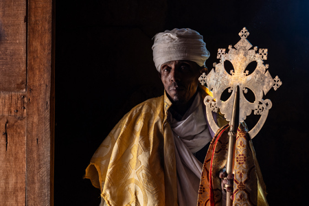 Priest With A Cross