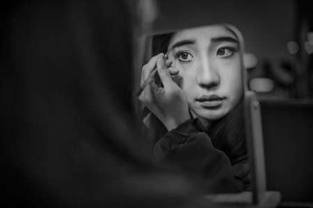 Makeup In Front Of A Mirror