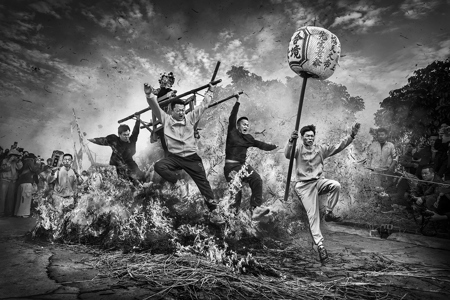 Four People Jumping Fire