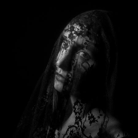 A Wistful Look Through Black Lace