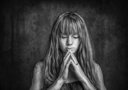 With Praying Hands