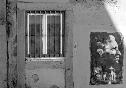 Common image in Lisbon showing an image on the wall of a house