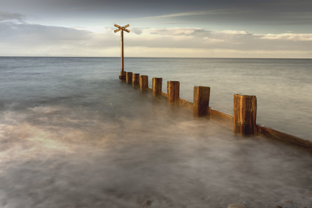 Beach groyne at sunset in Scotland